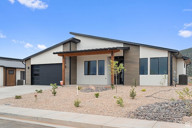 2639 S Mann Ln, Cedar City, UT 84720 - contemporary home featuring an attached garage, concrete driveway, and stucco siding