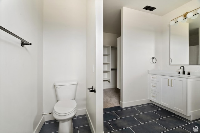 2639 S Mann Ln, Cedar City, UT 84720 - bathroom with vanity, tile patterned flooring, and a walk in closet