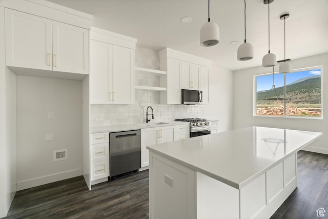 2639 S Mann Ln, Cedar City, UT 84720 - kitchen featuring stainless steel appliances, open shelves, tasteful backsplash, and dark wood finished floors