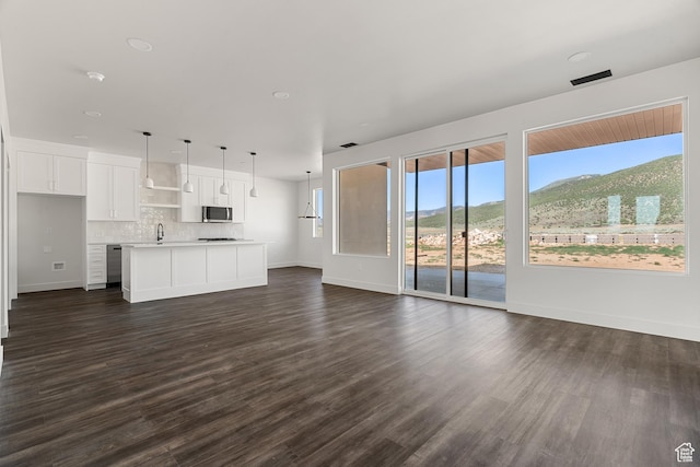 2639 S Mann Ln, Cedar City, UT 84720 - unfurnished living room with dark wood finished floors and a mountain view