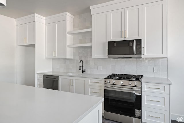 2639 S Mann Ln, Cedar City, UT 84720 - kitchen featuring appliances with stainless steel finishes, open shelves, light countertops, and white cabinetry