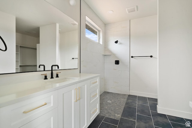 2639 S Mann Ln, Cedar City, UT 84720 - full bathroom featuring a walk in shower, vanity, and tile patterned flooring