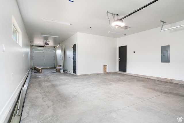 2639 S Mann Ln, Cedar City, UT 84720 - garage with electric panel, a garage door opener, and baseboard heating