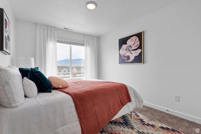 1282 N 375 E Unit 150, Harrisville, UT 84404 - carpeted bedroom with baseboards and a mountain view
