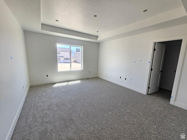 1726 S 3875 W Unit 225, West Weber, UT 84401 - spare room with carpet flooring and a raised ceiling