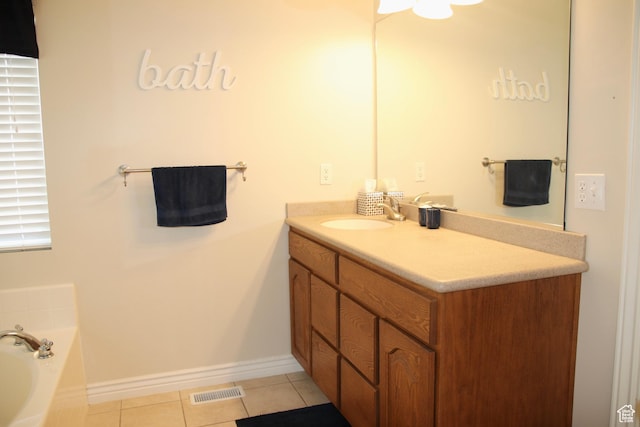 270 Amsterdam Dr, Stansbury Park, UT 84074 - full bathroom featuring vanity, tile patterned floors, and a bath