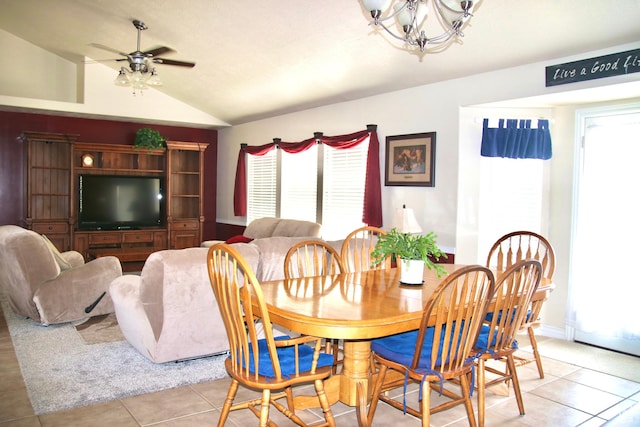 270 Amsterdam Dr, Stansbury Park, UT 84074 - dining area with a chandelier, vaulted ceiling, light tile patterned floors, and a ceiling fan