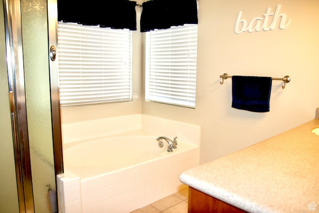 270 Amsterdam Dr, Stansbury Park, UT 84074 - full bath featuring vanity, a garden tub, tile patterned flooring, and an enclosed shower
