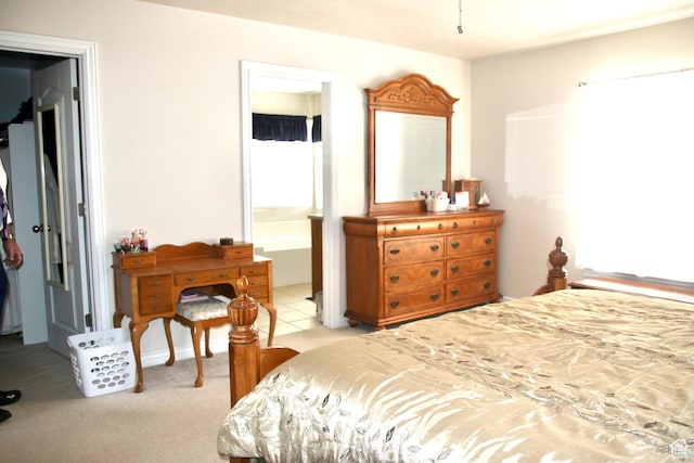 270 Amsterdam Dr, Stansbury Park, UT 84074 - bedroom with ensuite bath and light colored carpet
