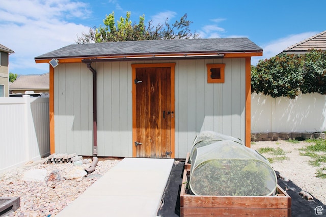 270 Amsterdam Dr, Stansbury Park, UT 84074 - view of shed featuring a fenced backyard