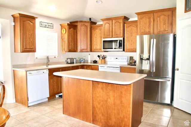 270 Amsterdam Dr, Stansbury Park, UT 84074 - kitchen featuring appliances with stainless steel finishes, a kitchen island, light countertops, light tile patterned flooring, and recessed lighting