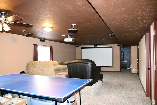 270 Amsterdam Dr, Stansbury Park, UT 84074 - carpeted cinema with ceiling fan and baseboards