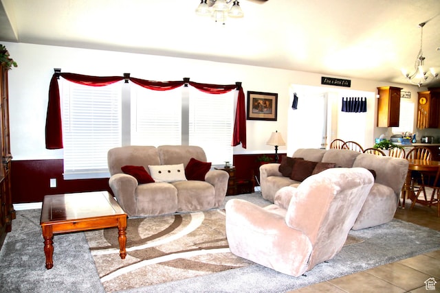 270 Amsterdam Dr, Stansbury Park, UT 84074 - living area with ceiling fan, a chandelier, and tile patterned flooring