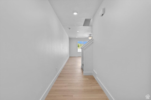 211 W 815 N Unit 19, Nephi, UT 84648 - corridor featuring light wood-style floors, recessed lighting, and a textured ceiling
