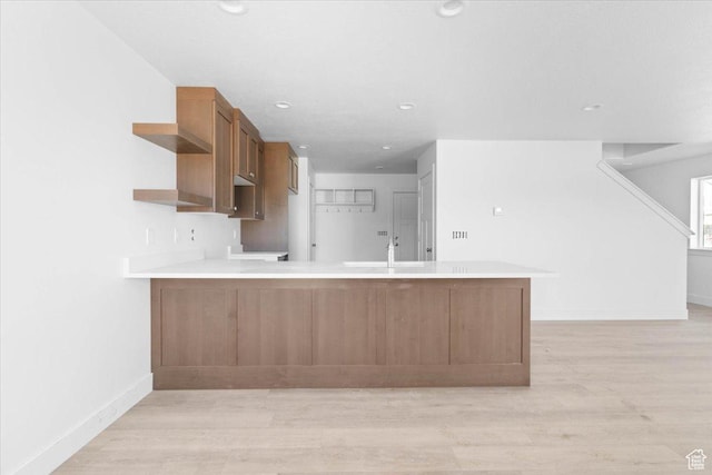 211 W 815 N Unit 19, Nephi, UT 84648 - kitchen with a peninsula, light wood finished floors, light countertops, open shelves, and recessed lighting