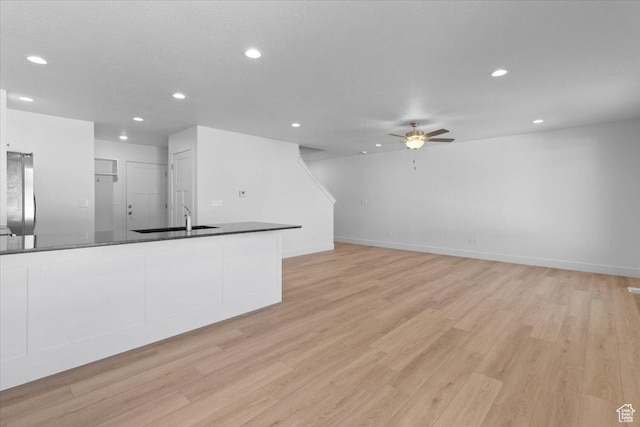 211 W 815 N Unit 19, Nephi, UT 84648 - unfurnished living room with a ceiling fan, recessed lighting, and light wood finished floors