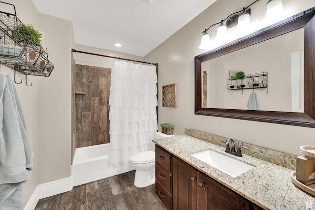 126 N Balsam Way W, Price, UT 84501 - bathroom featuring vanity, wood finished floors, shower / bath combo with shower curtain, and recessed lighting
