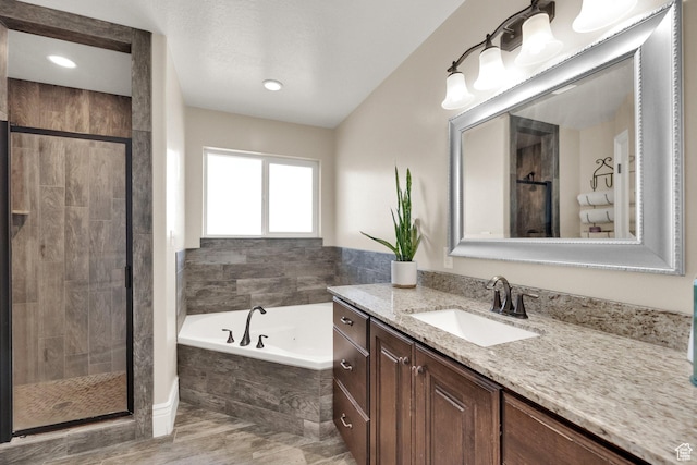 126 N Balsam Way W, Price, UT 84501 - bathroom with vanity, a garden tub, a shower stall, and wood finished floors