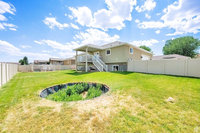 126 N Balsam Way W, Price, UT 84501 - rear view of property with stairs, a fenced backyard, a wooden deck, and stucco siding