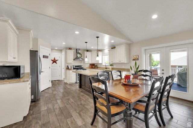126 N Balsam Way W, Price, UT 84501 - dining space with lofted ceiling, wood finished floors, recessed lighting, and french doors