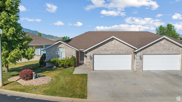 347 N 220 W, Salem, UT 84653 - view of front of house with concrete driveway, an attached garage, a front lawn, brick siding, and a shingled roof