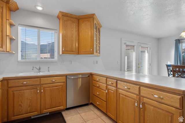 347 N 220 W, Salem, UT 84653 - kitchen with dishwasher, a peninsula, light countertops, light tile patterned flooring, and glass insert cabinets