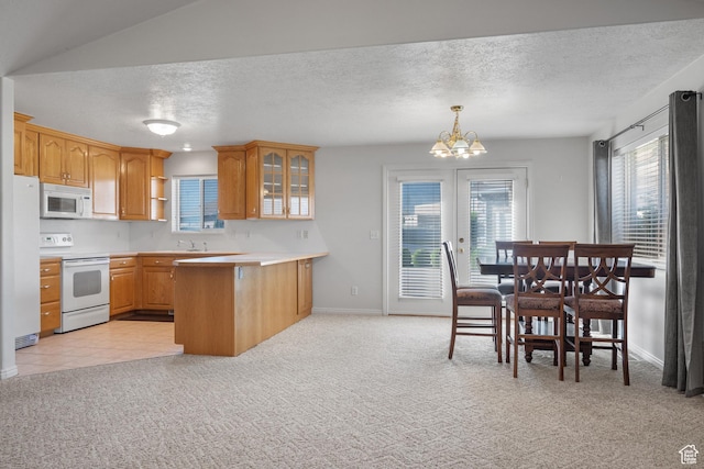 347 N 220 W, Salem, UT 84653 - kitchen with white appliances, light colored carpet, a peninsula, glass insert cabinets, and a chandelier