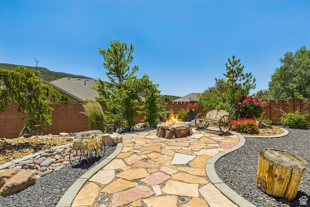 1283 W 1750 S, Cedar City, UT 84720 - fenced backyard featuring a fire pit and a patio