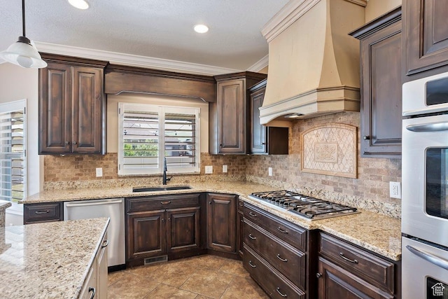 2131 S 1230 W, Syracuse, UT 84075 - kitchen featuring premium range hood, appliances with stainless steel finishes, dark brown cabinetry, tasteful backsplash, and ornamental molding