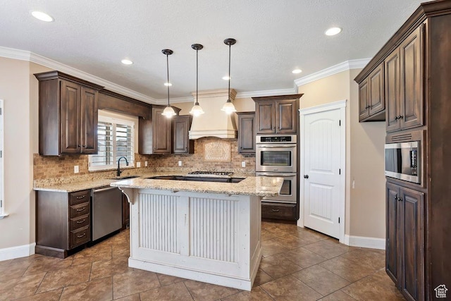 2131 S 1230 W, Syracuse, UT 84075 - kitchen featuring appliances with stainless steel finishes, dark brown cabinetry, tasteful backsplash, a center island, and light stone countertops