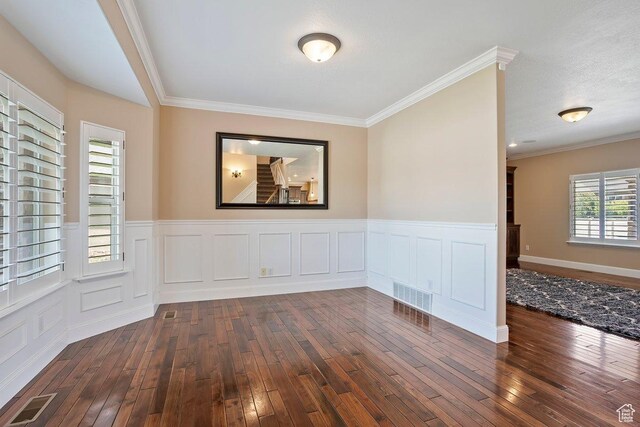 2131 S 1230 W, Syracuse, UT 84075 - unfurnished room featuring dark wood-style floors, a wainscoted wall, ornamental molding, and a decorative wall