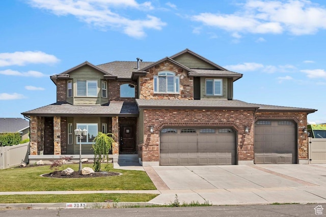2131 S 1230 W, Syracuse, UT 84075 - view of front of house with driveway, brick siding, an attached garage, and a shingled roof