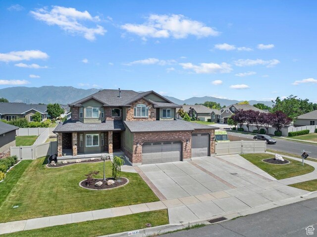 2131 S 1230 W, Syracuse, UT 84075 - view of front of property featuring driveway, a mountain view, a gate, a residential view, and a garage