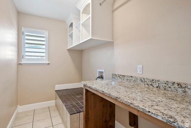 2131 S 1230 W, Syracuse, UT 84075 - laundry area with washer hookup, a desk, and light tile patterned floors
