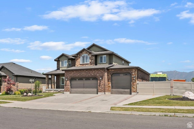 2131 S 1230 W, Syracuse, UT 84075 - view of front facade with concrete driveway, brick siding, an attached garage, and a mountain view