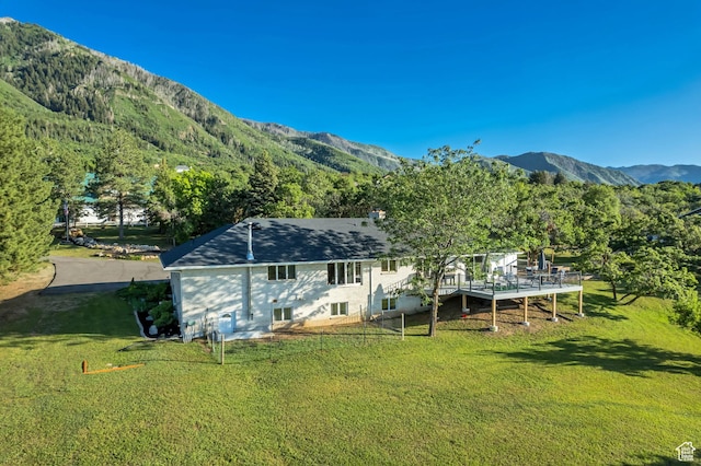 685 S Woodland Hills Dr, Woodland Hills, UT 84653 - rear view of property with a lawn and a deck with mountain view