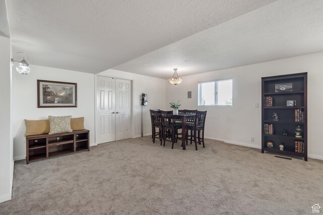 685 S Woodland Hills Dr, Woodland Hills, UT 84653 - carpeted dining area with a textured ceiling and baseboards