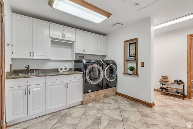 685 S Woodland Hills Dr, Woodland Hills, UT 84653 - laundry area featuring cabinet space, separate washer and dryer, and light tile patterned floors