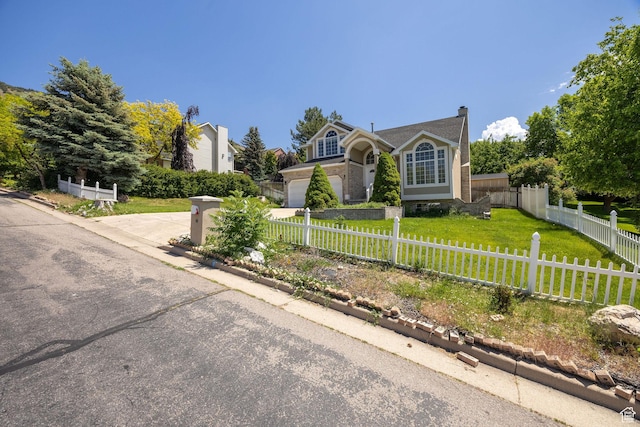 672 E Center St, Providence, UT 84332 - view of front of home featuring a fenced front yard and concrete driveway