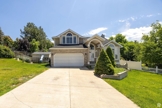 672 E Center St, Providence, UT 84332 - view of front of home featuring an attached garage, driveway, stucco siding, and a chimney