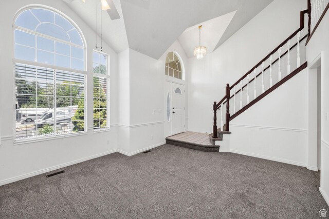 672 E Center St, Providence, UT 84332 - carpeted entryway featuring a chandelier, lofted ceiling, stairway, and a ceiling fan