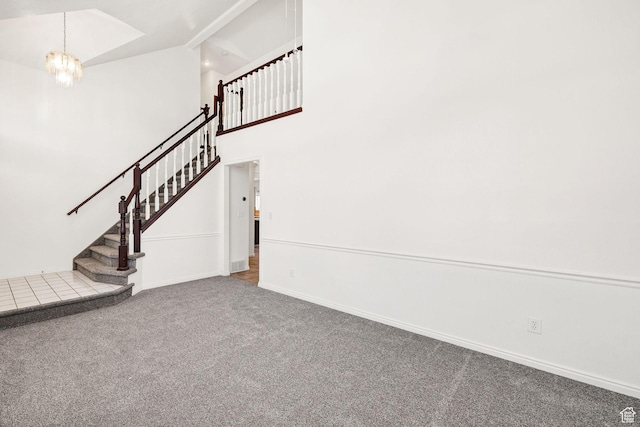 672 E Center St, Providence, UT 84332 - staircase featuring carpet floors, a chandelier, and high vaulted ceiling