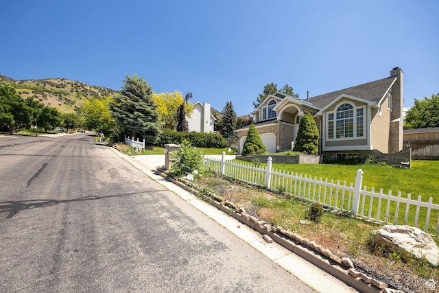 672 E Center St, Providence, UT 84332 - view of asphalt road featuring curbs