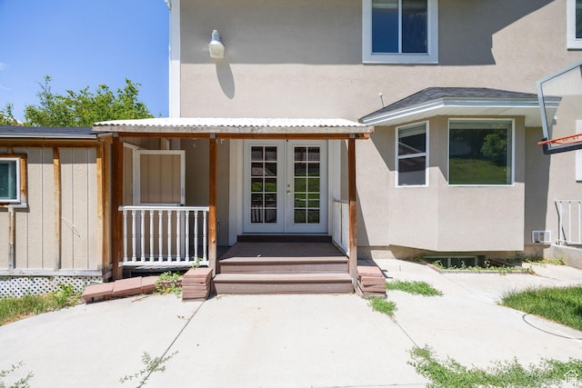 672 E Center St, Providence, UT 84332 - entrance to property with french doors, stucco siding, and a porch