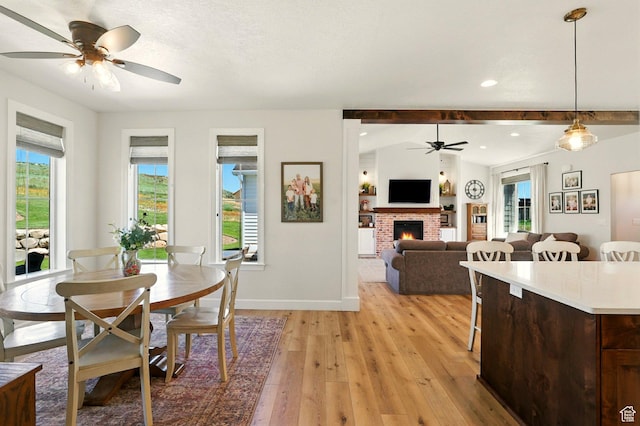 13189 N Brookside Dr, Garland, UT 84312 - dining space featuring a ceiling fan, light wood-style flooring, a fireplace, and recessed lighting
