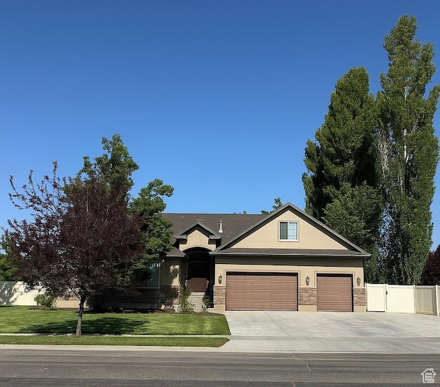 2832 S 1200 W, Syracuse, UT 84075 - ranch-style home featuring stucco siding, driveway, stone siding, and a garage