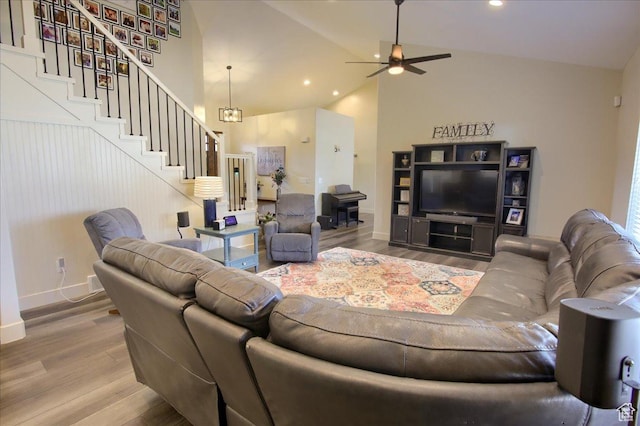 2832 S 1200 W, Syracuse, UT 84075 - living area with stairway, wood finished floors, ceiling fan, recessed lighting, and high vaulted ceiling
