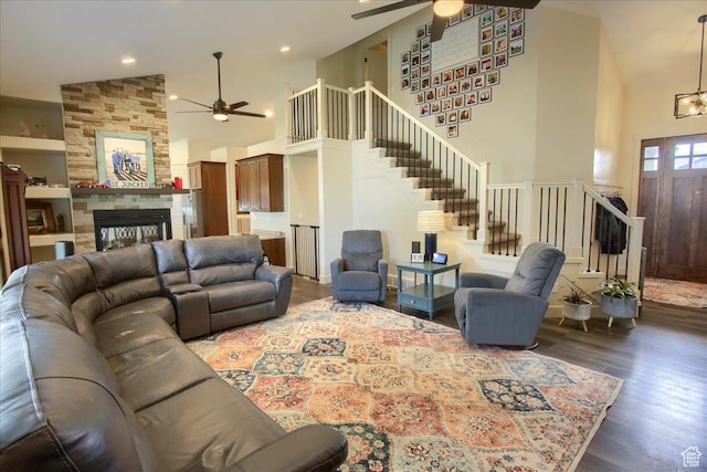 2832 S 1200 W, Syracuse, UT 84075 - living room featuring ceiling fan, high vaulted ceiling, stairs, hardwood / wood-style flooring, and a fireplace