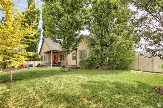 2832 S 1200 W, Syracuse, UT 84075 - fenced backyard featuring a gate and a patio area
