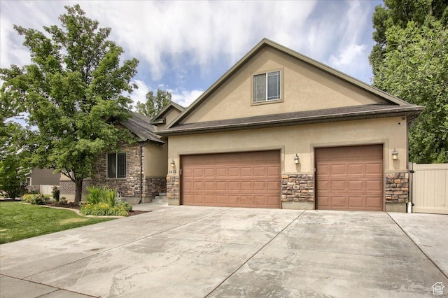 2832 S 1200 W, Syracuse, UT 84075 - view of front of house featuring stone siding, stucco siding, concrete driveway, and an attached garage